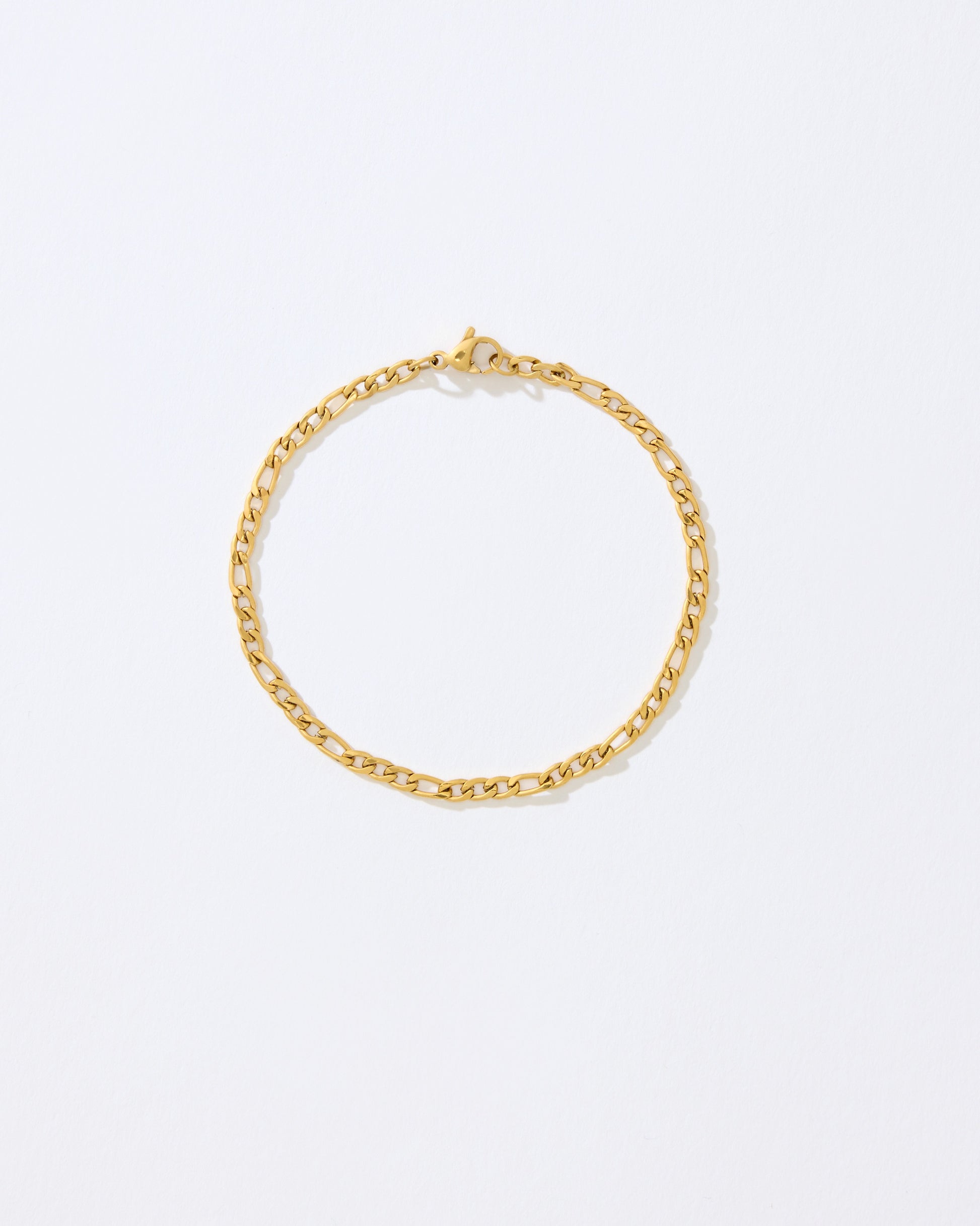 Gold chain bracelet on a white background