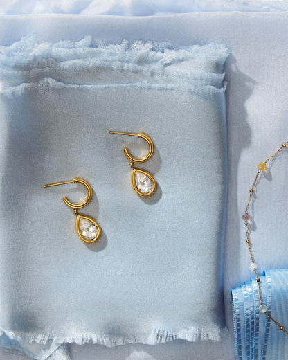 Julie Earrings on light blue fabric